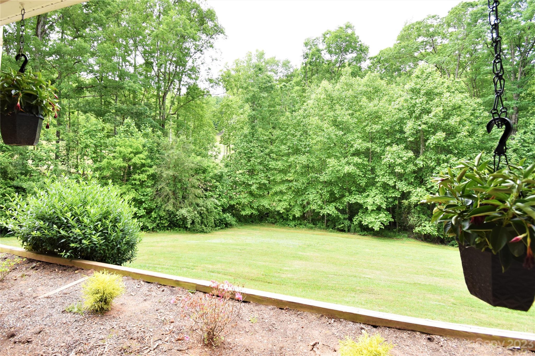 7 Krista Circle, Unit E Candler, NC 28715 - Photo 22 of 24 a view of a yard with an outdoor space