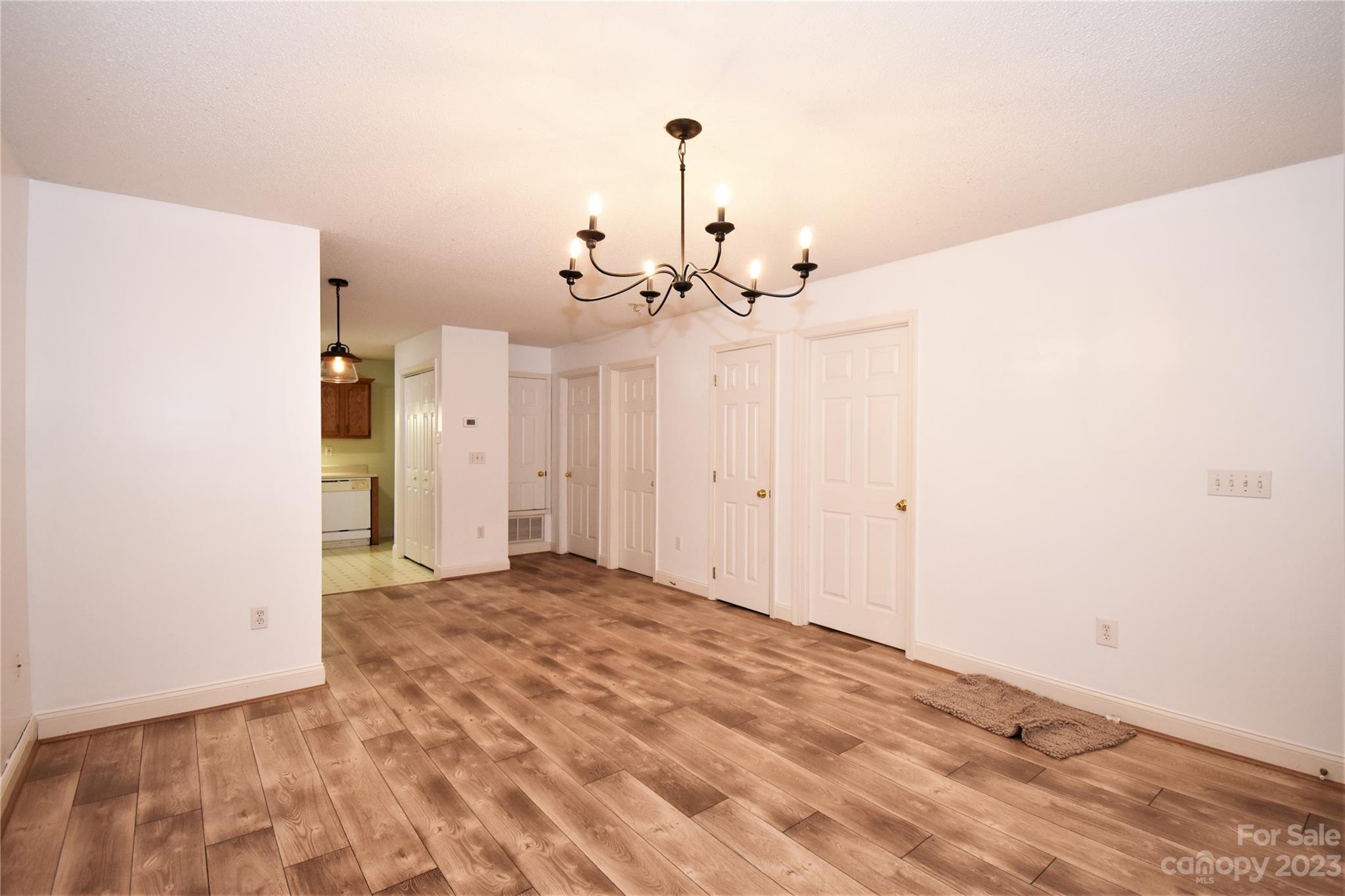 7 Krista Circle, Unit E Candler, NC 28715 - Photo 3 of 24 a view of a livingroom with a chandelier