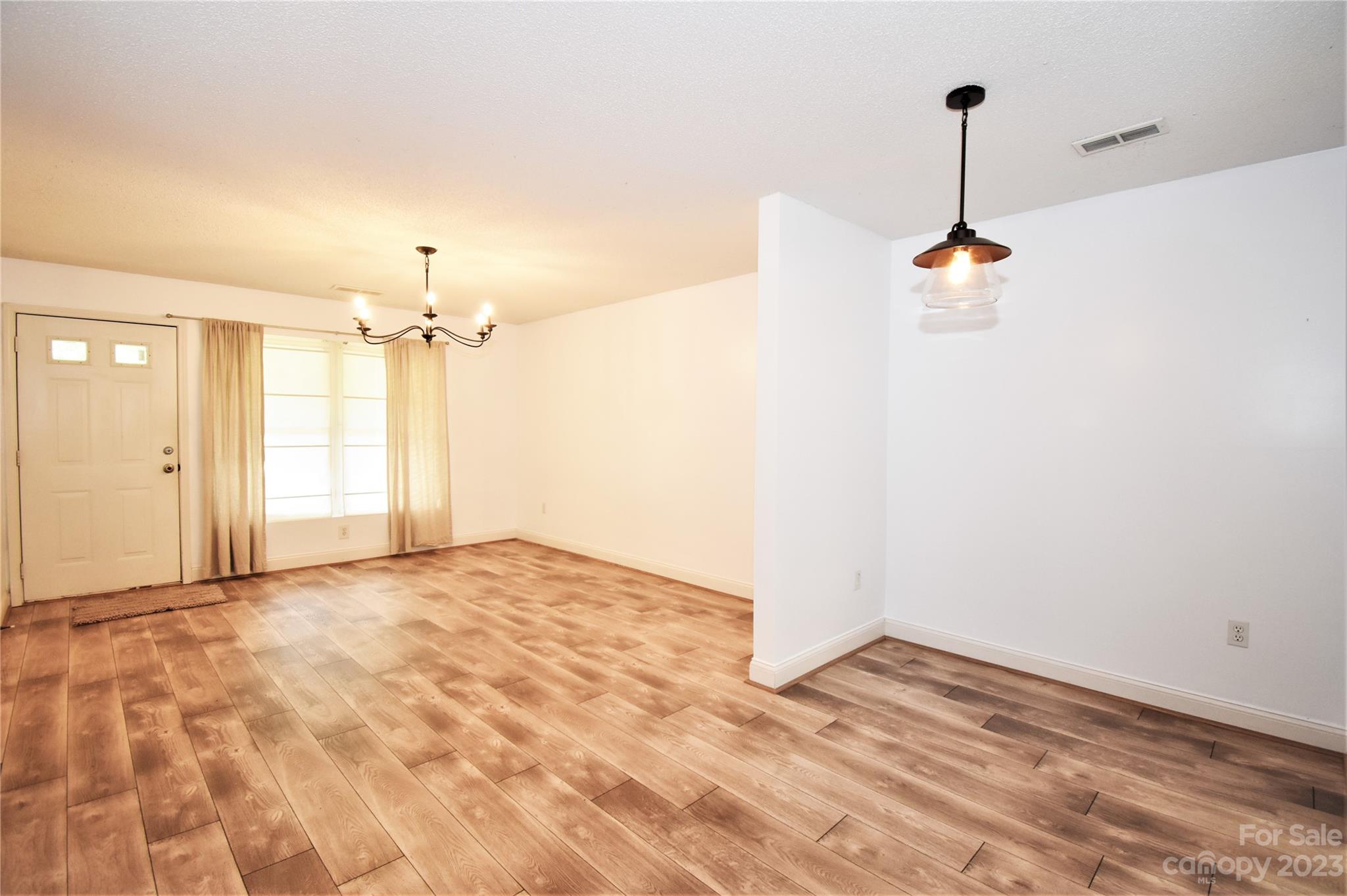 7 Krista Circle, Unit E Candler, NC 28715 - Photo 5 of 24 a view of empty room with a ceiling fan