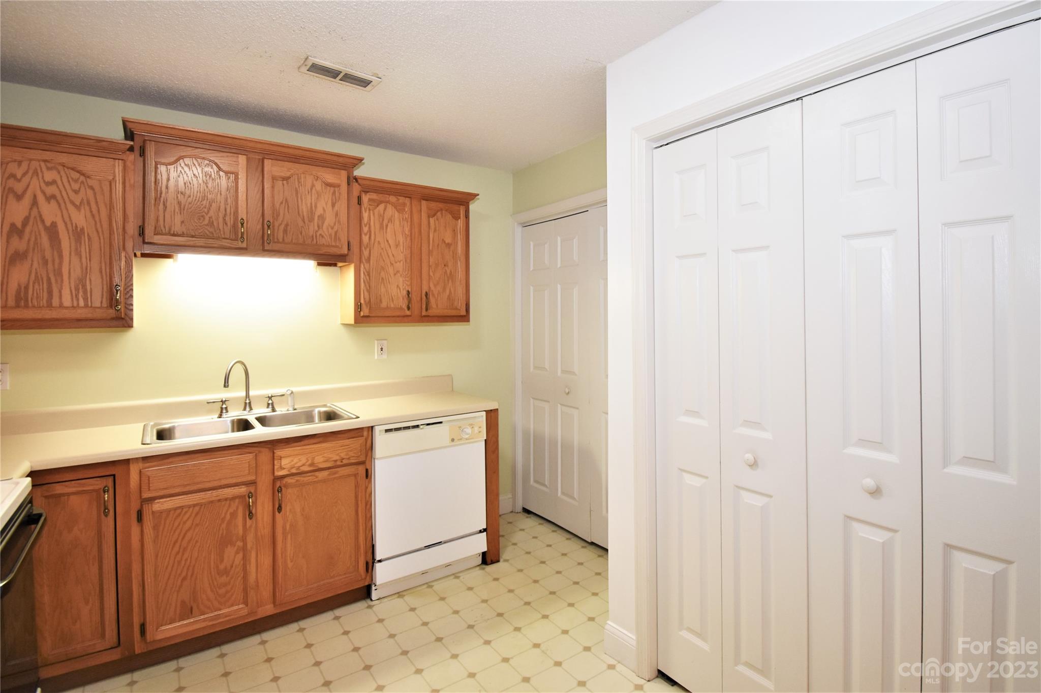 7 Krista Circle, Unit E Candler, NC 28715 - Photo 8 of 24 a kitchen with a sink and cabinets