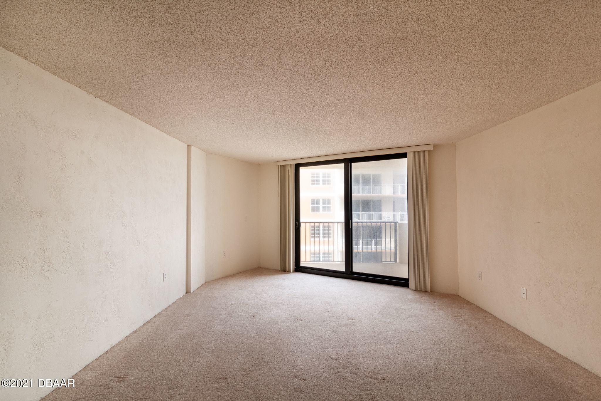 1415 Ocean Shore Boulevard, Unit 903 Ormond Beach, FL 32176 - Photo 11 of 47 a view of an empty room with a window