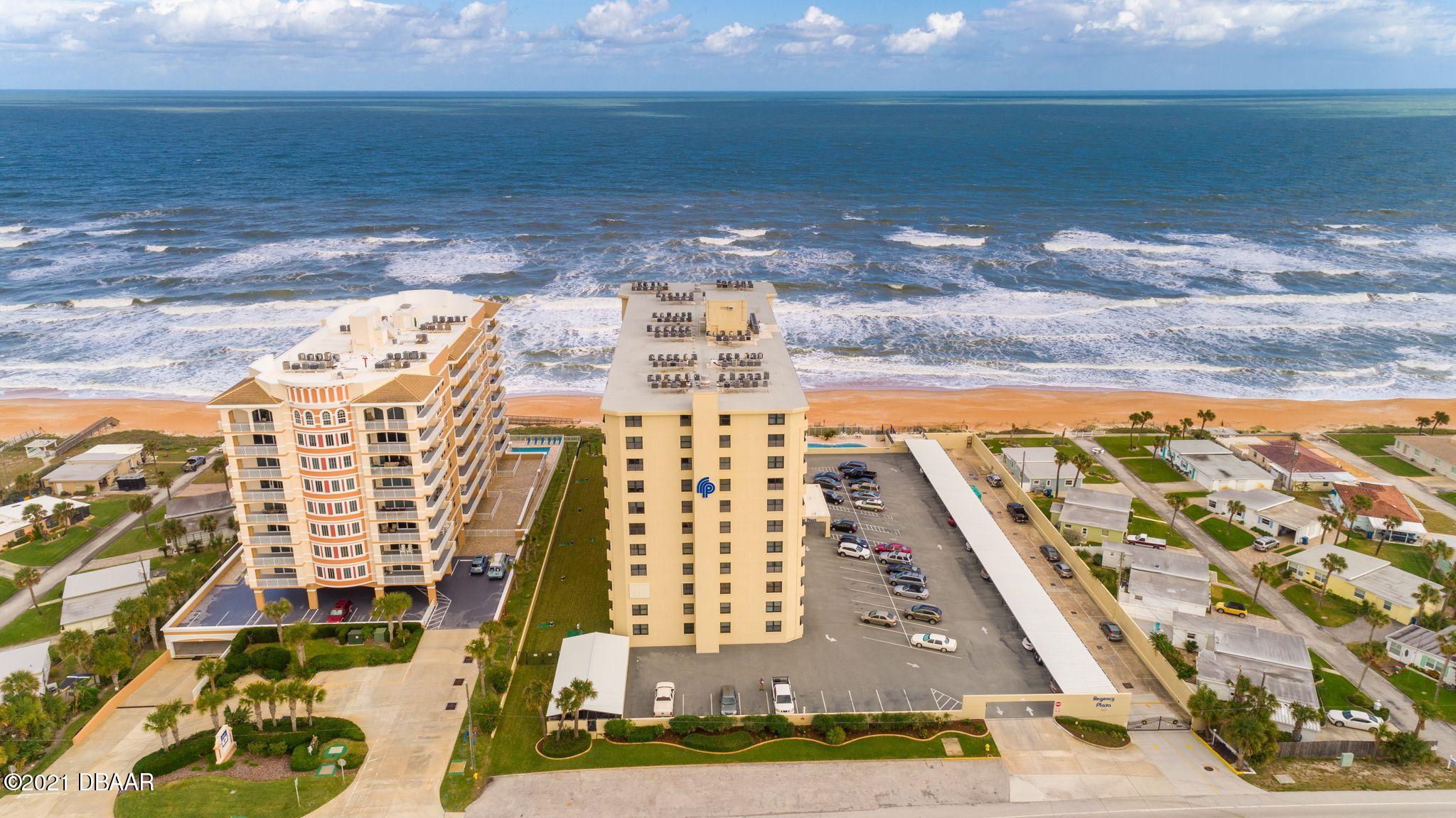 1415 Ocean Shore Boulevard, Unit 903 Ormond Beach, FL 32176 - Photo 33 of 47 a view of swimming pool with outdoor seating and yard in back
