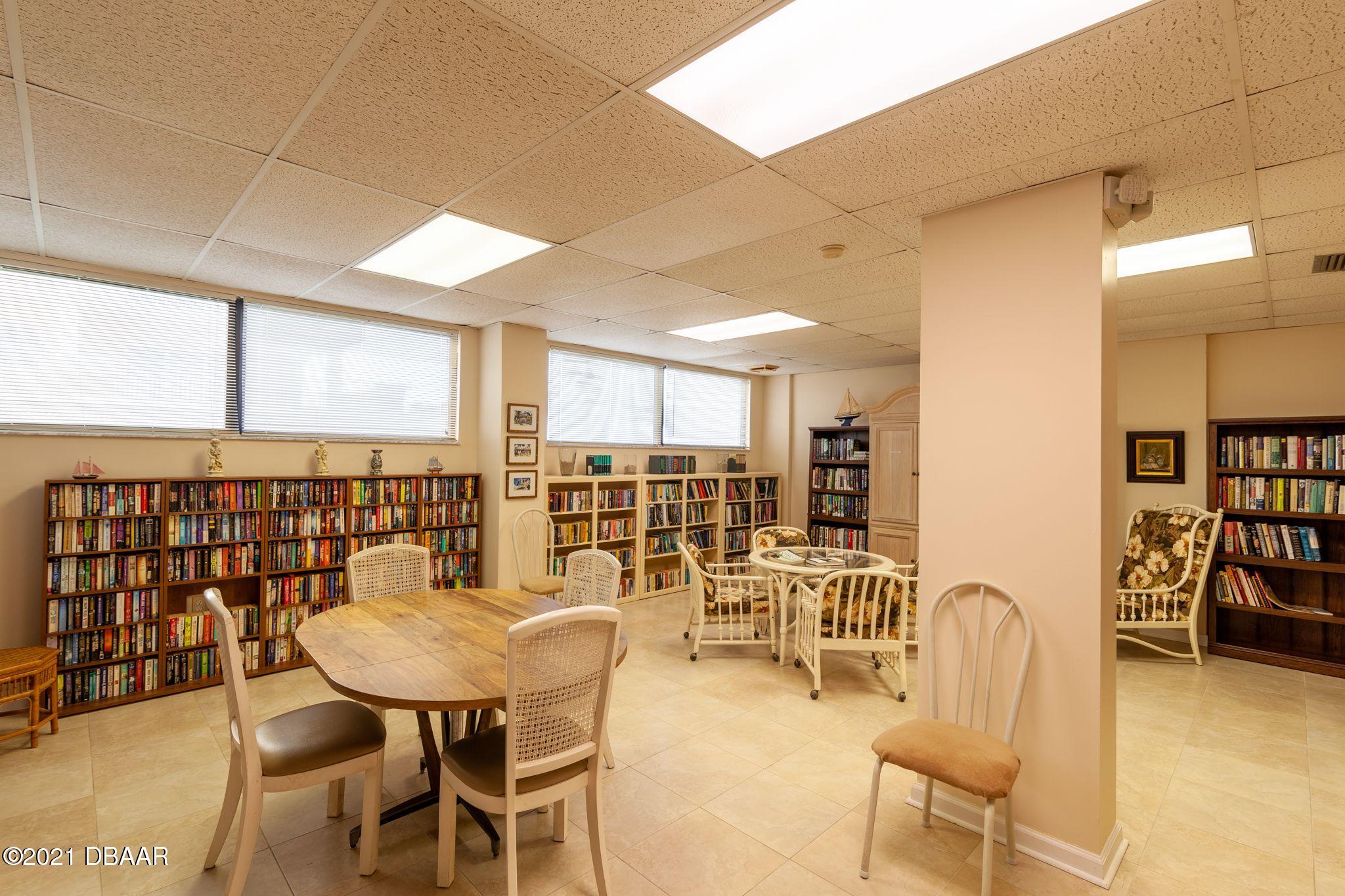 1415 Ocean Shore Boulevard, Unit 903 Ormond Beach, FL 32176 - Photo 40 of 47 a view of a dining room with furniture and window