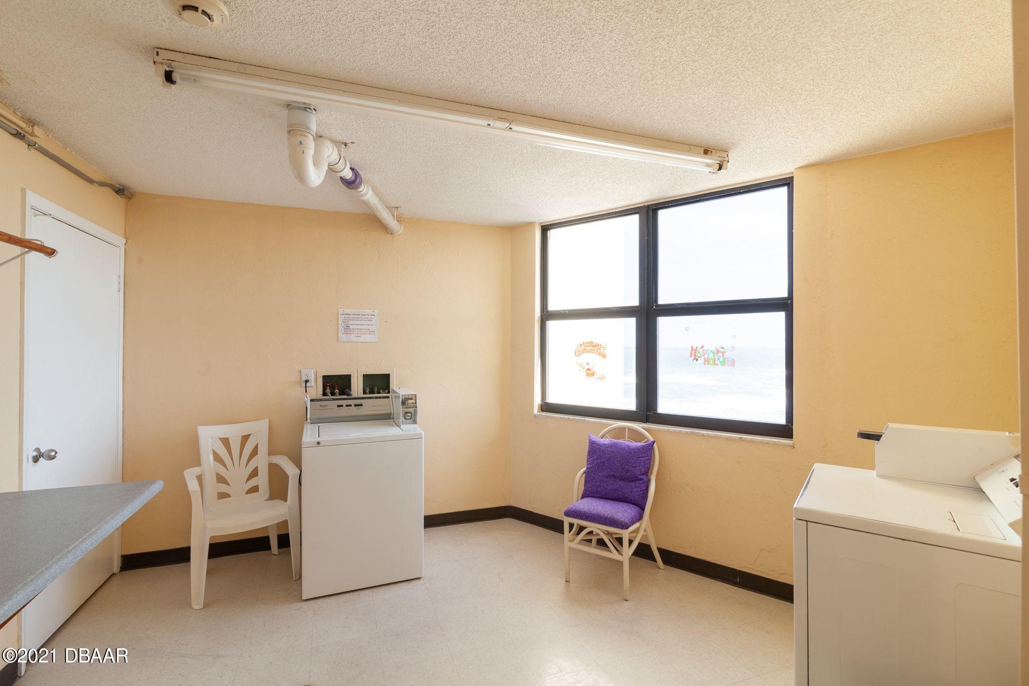 1415 Ocean Shore Boulevard, Unit 903 Ormond Beach, FL 32176 - Photo 47 of 47 a room with furniture and window