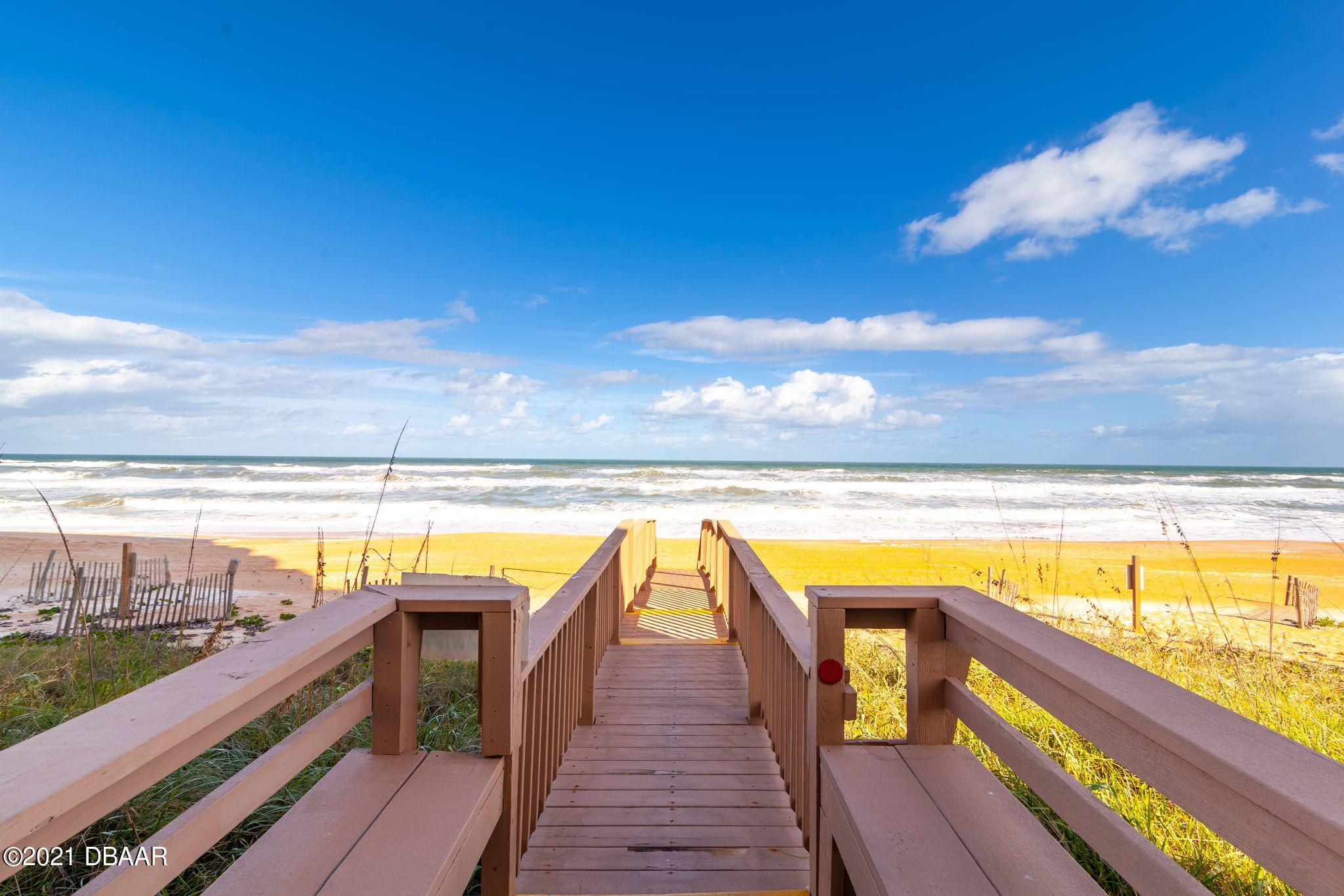 1415 Ocean Shore Boulevard, Unit 903 Ormond Beach, FL 32176 - Photo 6 of 47 a view of swimming pool with outdoor seating