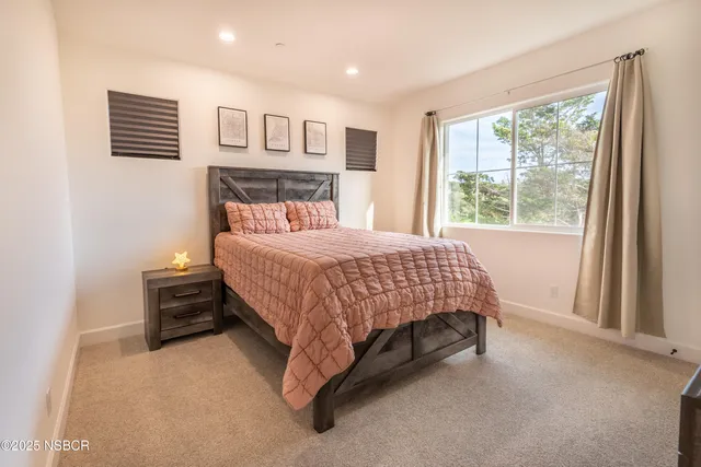 a view of walk in closet with clothes
