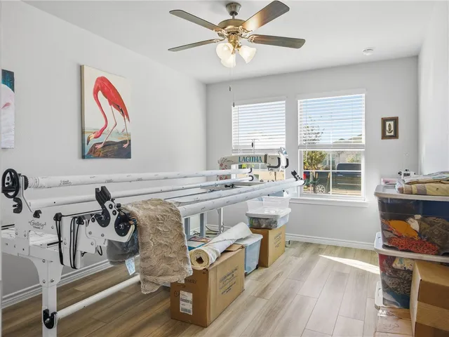 a view of a dining room with furniture and a large window