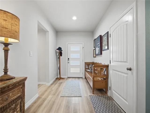 a view of a kitchen from the hallway
