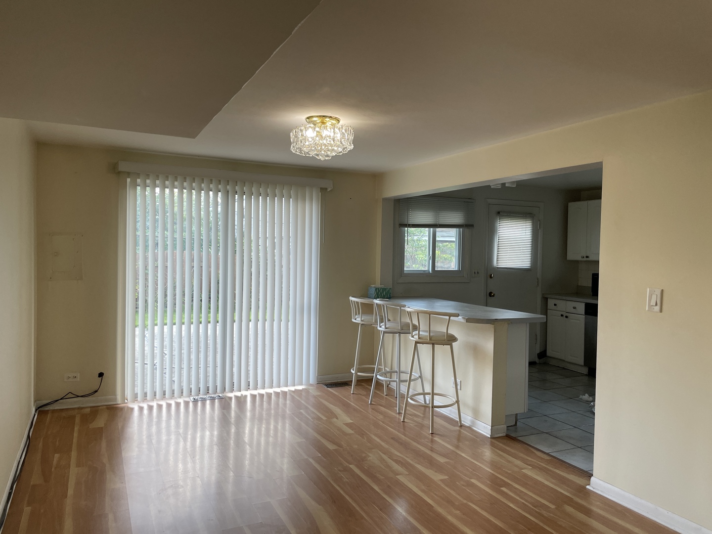 9137 Barberry Lane, Unit 9137 Des Plaines, IL 60016 - Photo 6 of 22 a view of a room with wooden floor and furniture