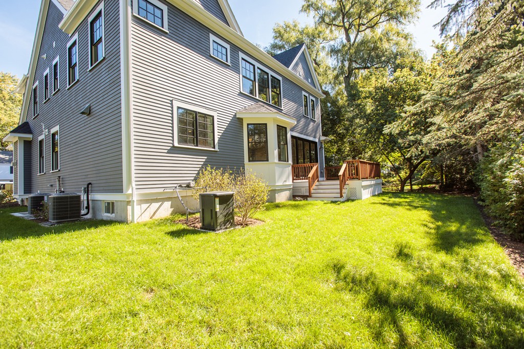 28 Bernard Road Wellesley, MA 02481 - Photo 23 of 23 a front view of a house with swimming pool and porch with furniture
