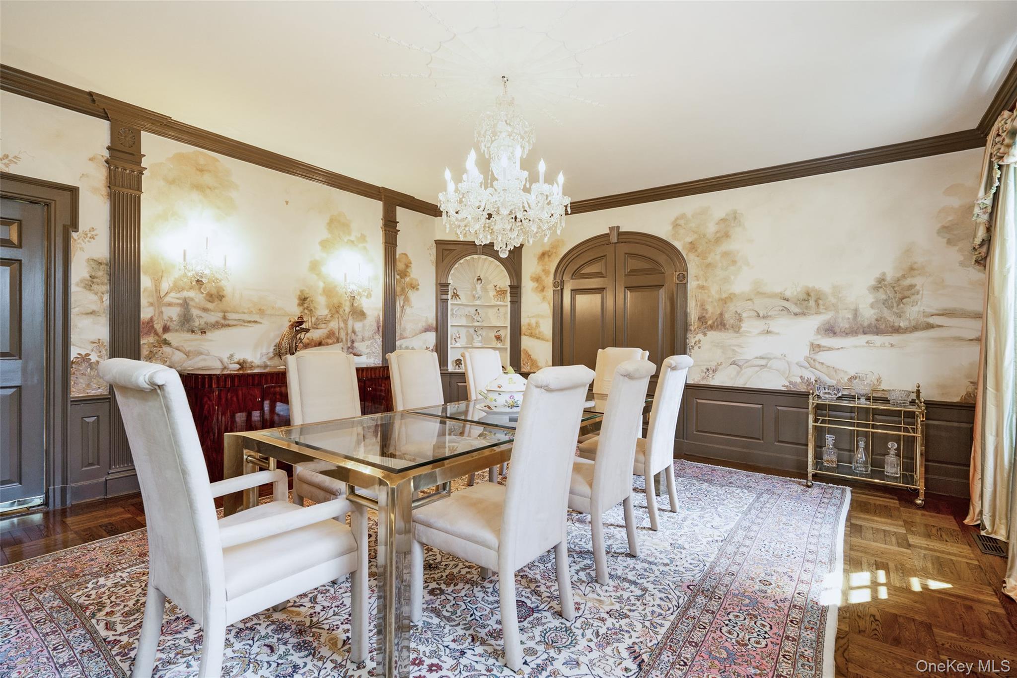 8 Cooper Road Scarsdale, NY 10583 - Photo 15 of 38 a dining room with furniture a chandelier and wooden floor