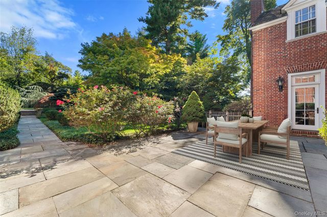 a view of a backyard with sitting area