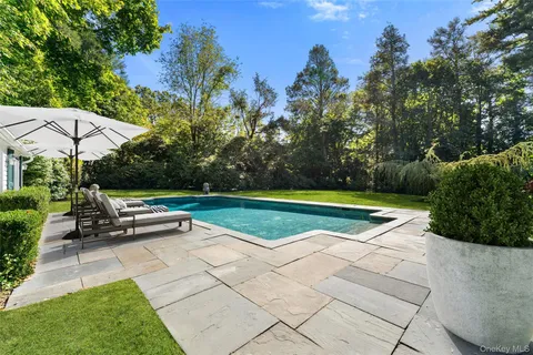 a view of a tennis ground with a lounge chair
