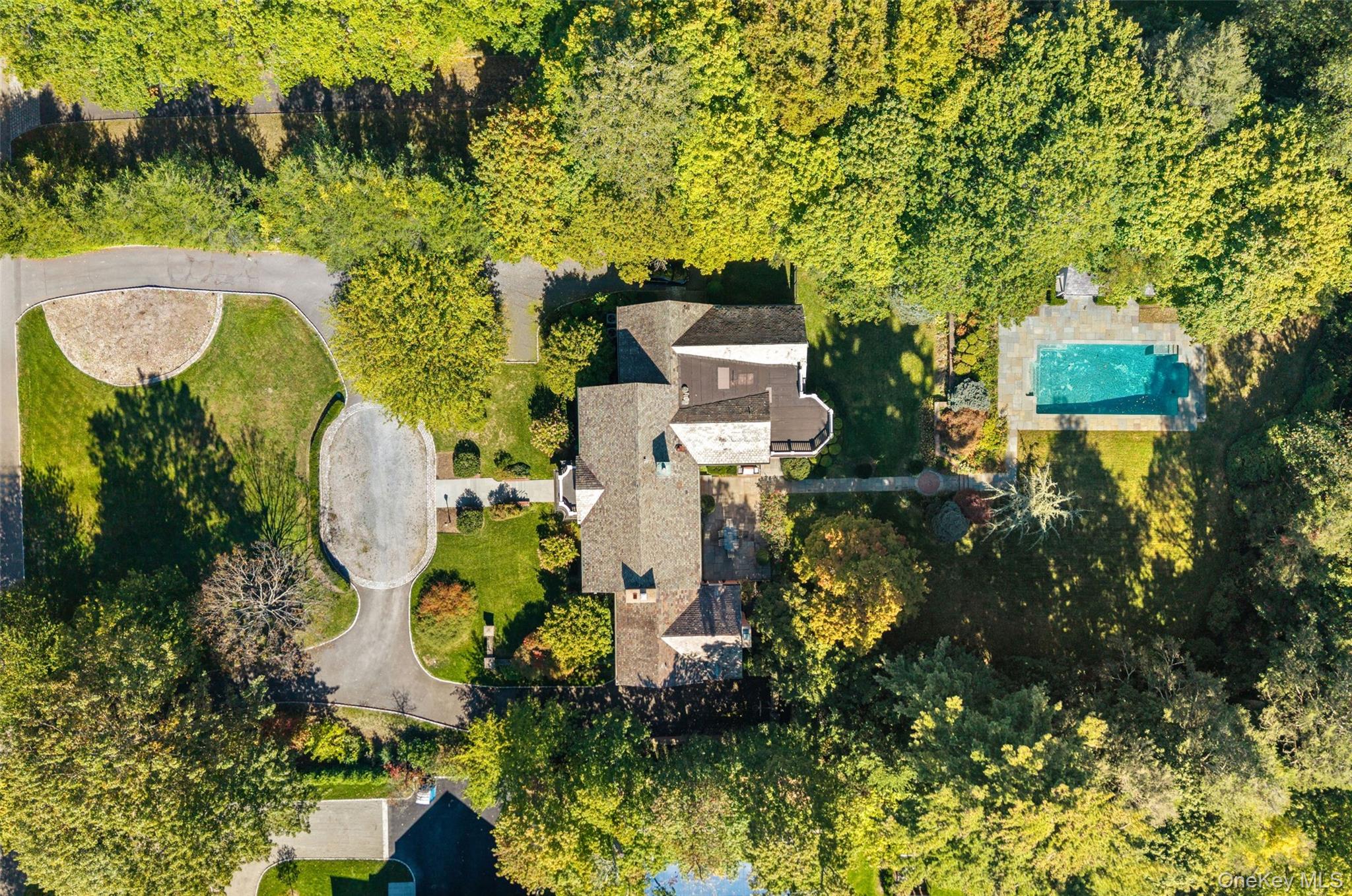 8 Cooper Road Scarsdale, NY 10583 - Photo 35 of 38 an aerial view of a house with a yard and large trees