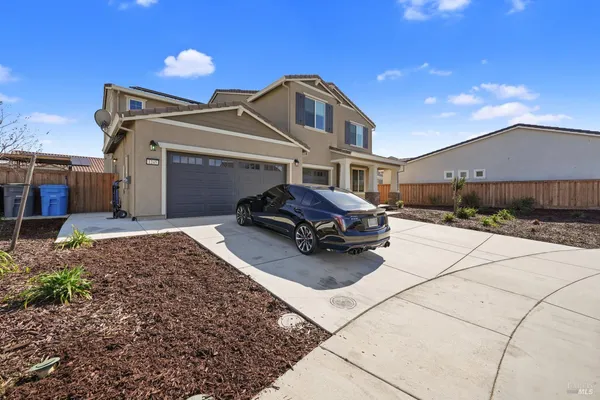 a kitchen with stainless steel appliances kitchen island granite countertop a stove and a refrigerator