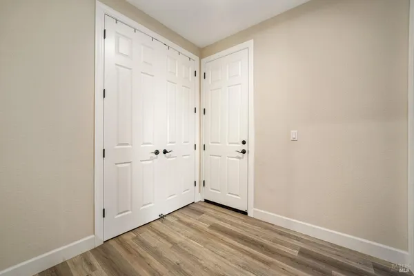 a bathroom with a sink toilet vanity and shower