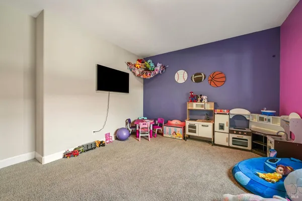 a view of a hall with wooden floor