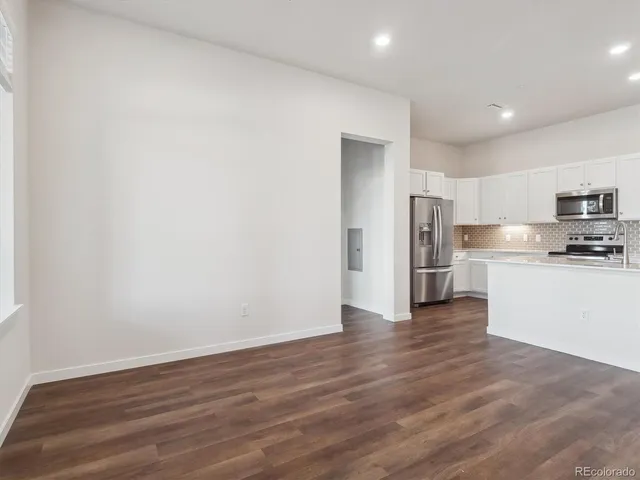 a view of kitchen with wooden floor