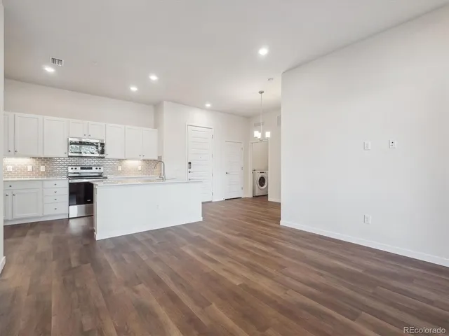 a view of kitchen with wooden floor