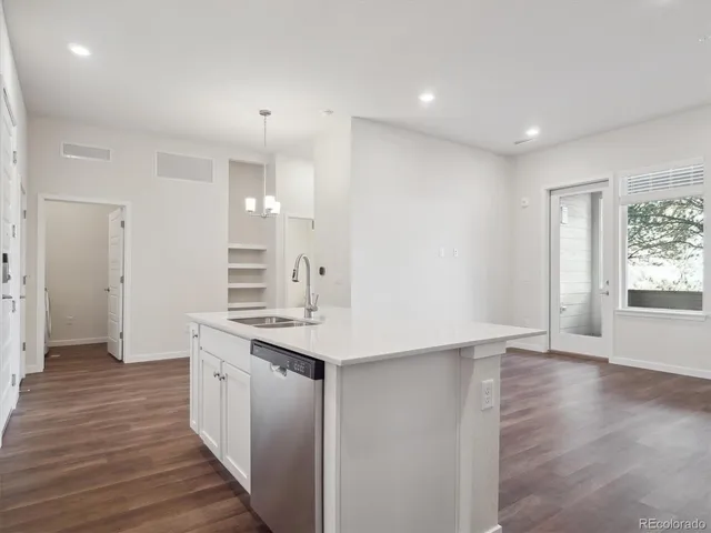 a bathroom with a sink a mirror and a shower
