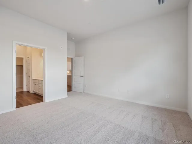 a view of an empty room and a window