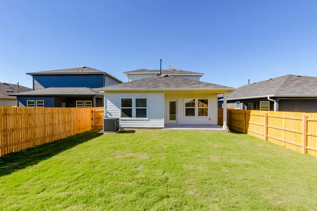 a front view of a house with yard