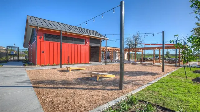 a view of a backyard with sitting area