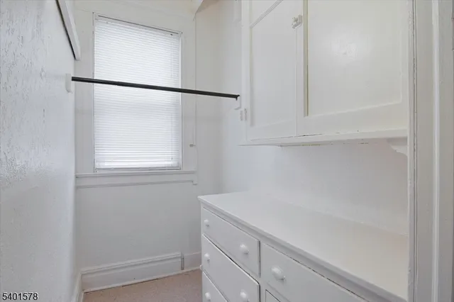 a bathroom with a shower and vanity