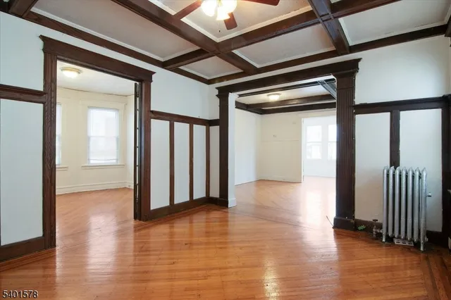 a view of gallery with wooden floor