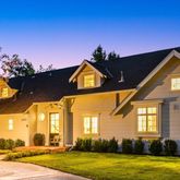 a front view of a house with a swimming pool