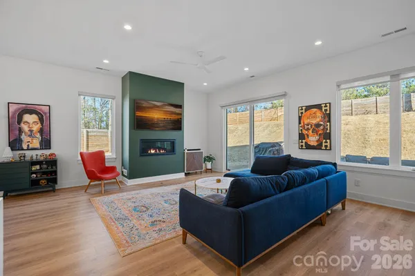 a living room with furniture window and flat screen tv