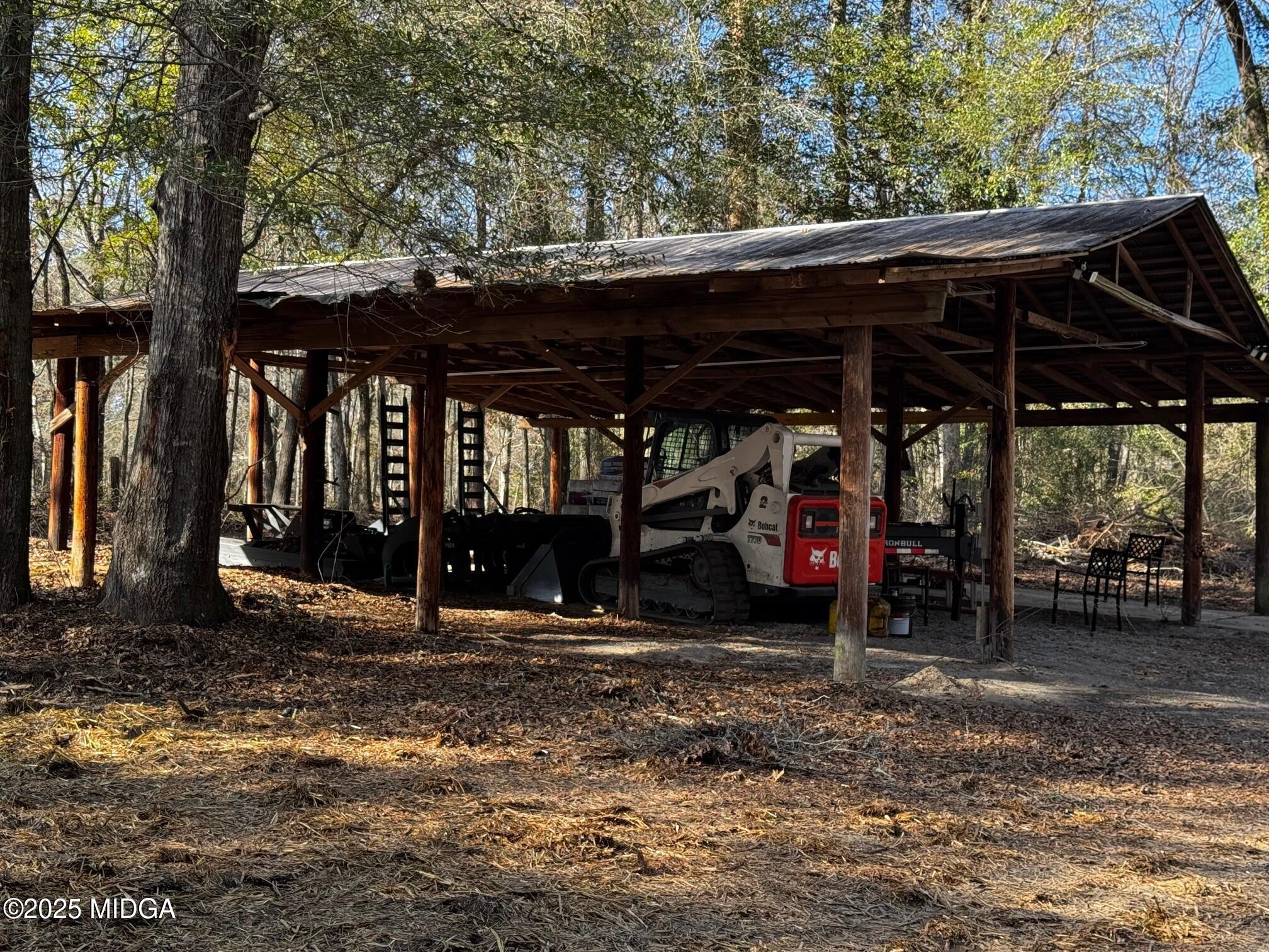4105 Holley Road Lizella, GA 31052 - Photo 16 of 78 a view of a car park in front of a house