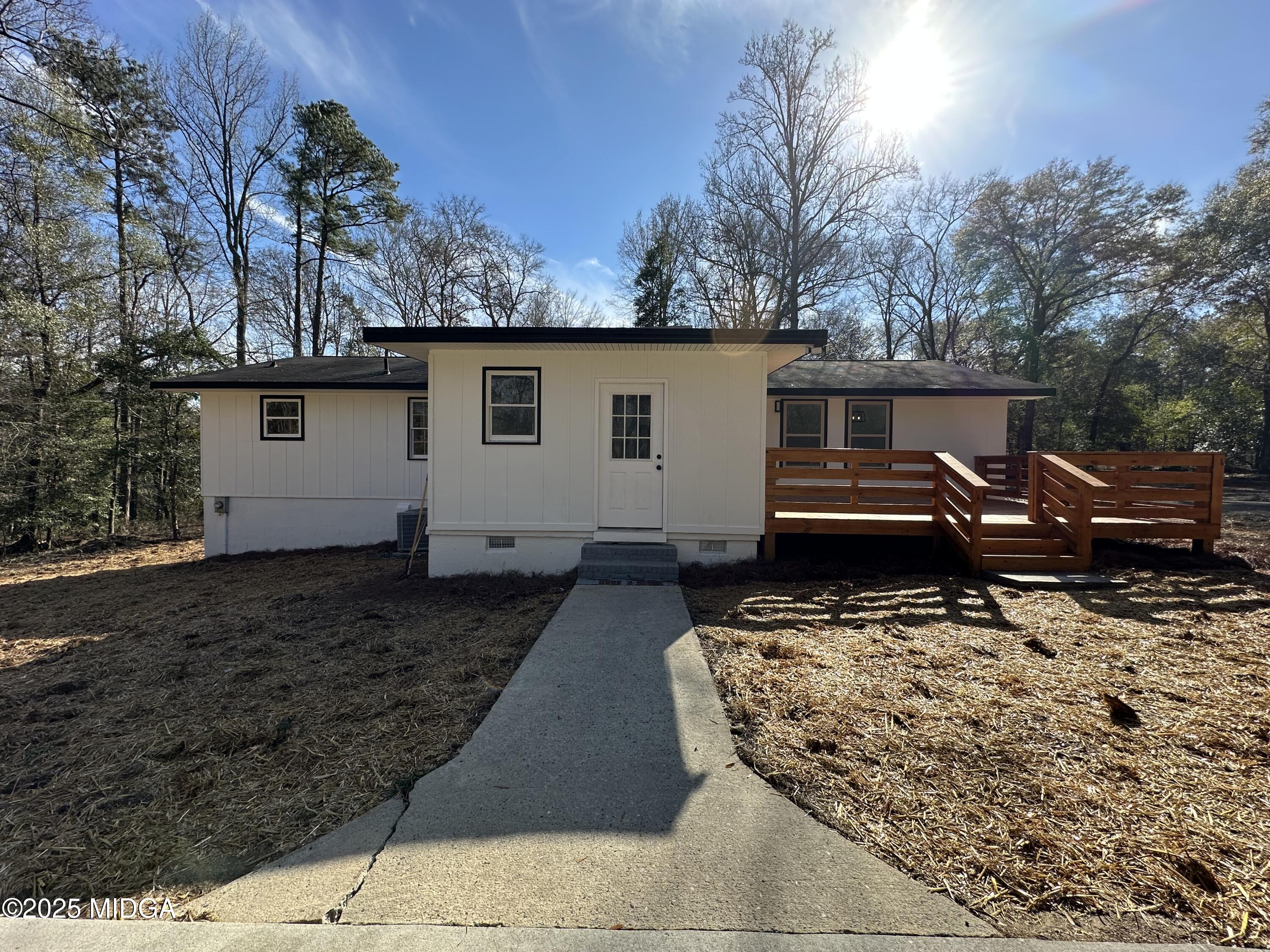 4105 Holley Road Lizella, GA 31052 - Photo 17 of 78 a view of a house with backyard and trees