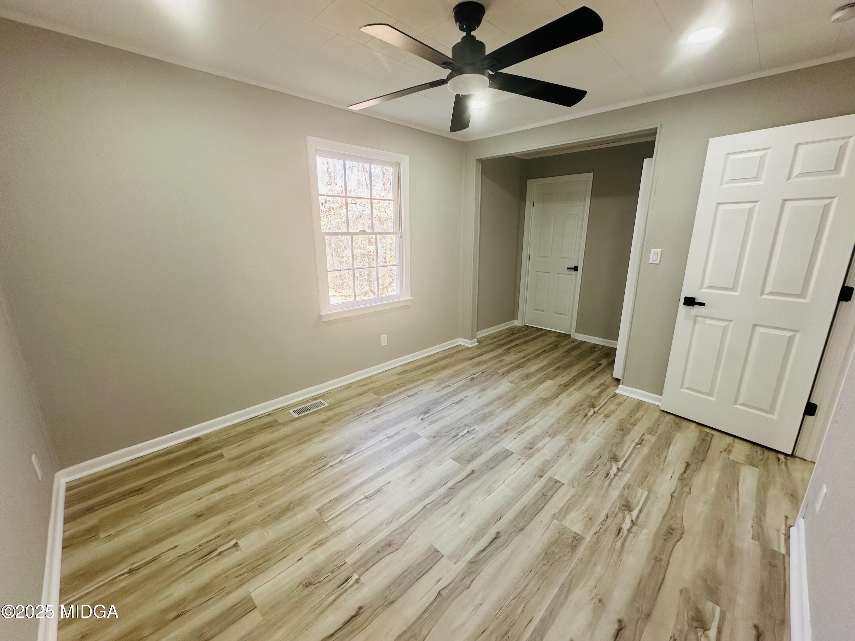 4105 Holley Road Lizella, GA 31052 - Photo 36 of 78 wooden floor in an empty room with a window