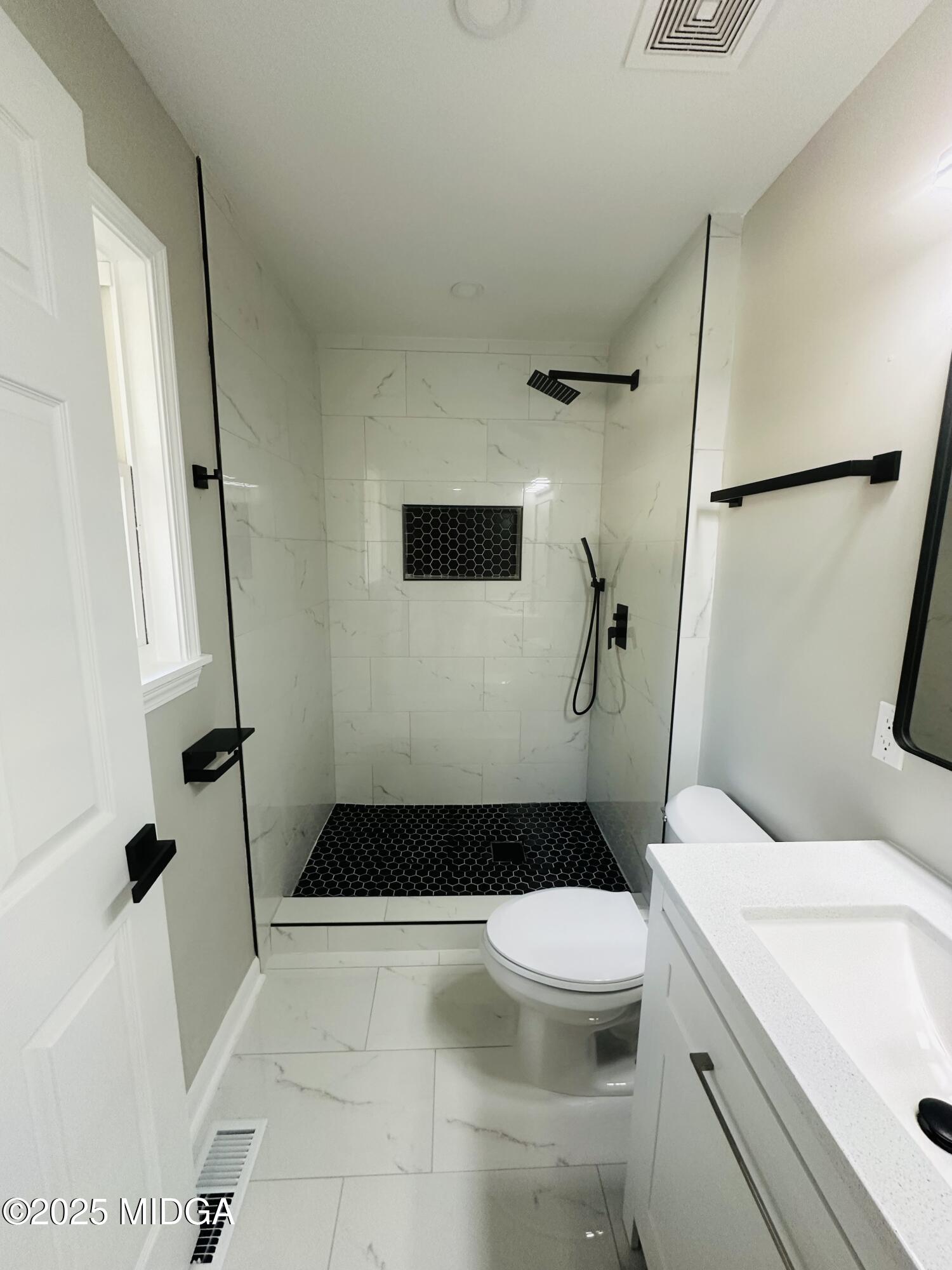 4105 Holley Road Lizella, GA 31052 - Photo 38 of 78 a bathroom with a sink a toilet and shower