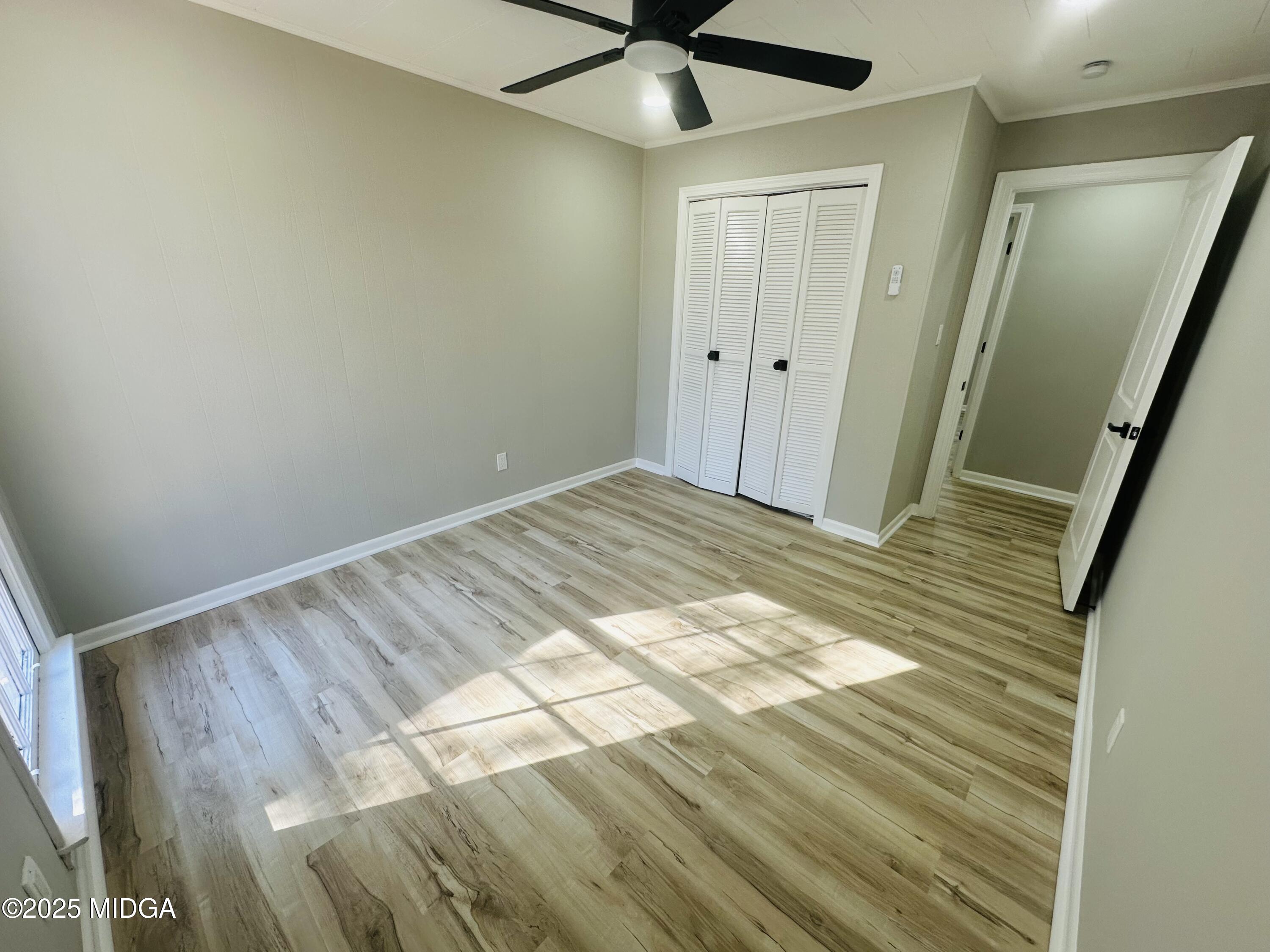 4105 Holley Road Lizella, GA 31052 - Photo 44 of 78 a view of a livingroom with wooden floor and white walls