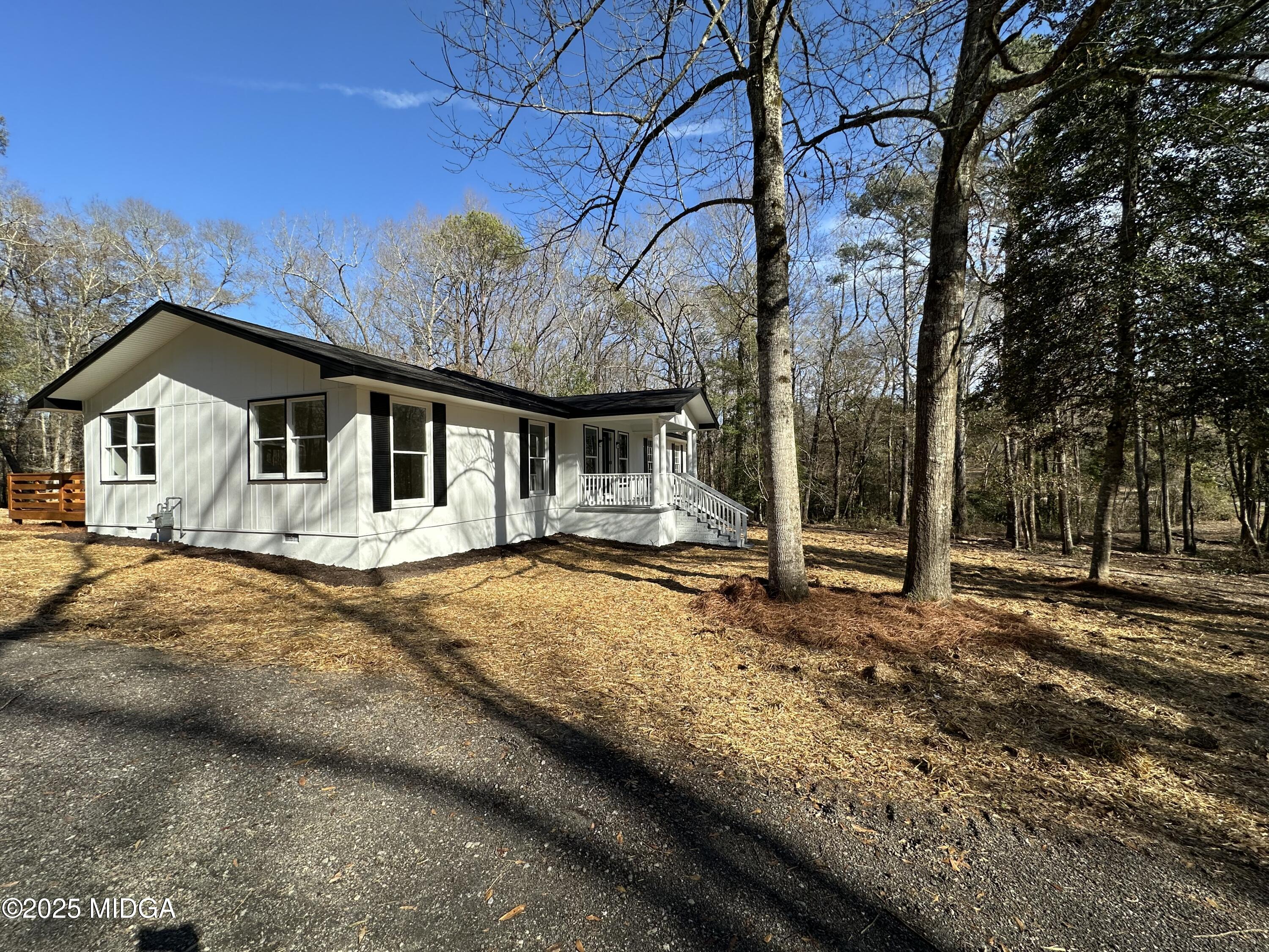 4105 Holley Road Lizella, GA 31052 - Photo 6 of 78 a view of a house with snow on the road