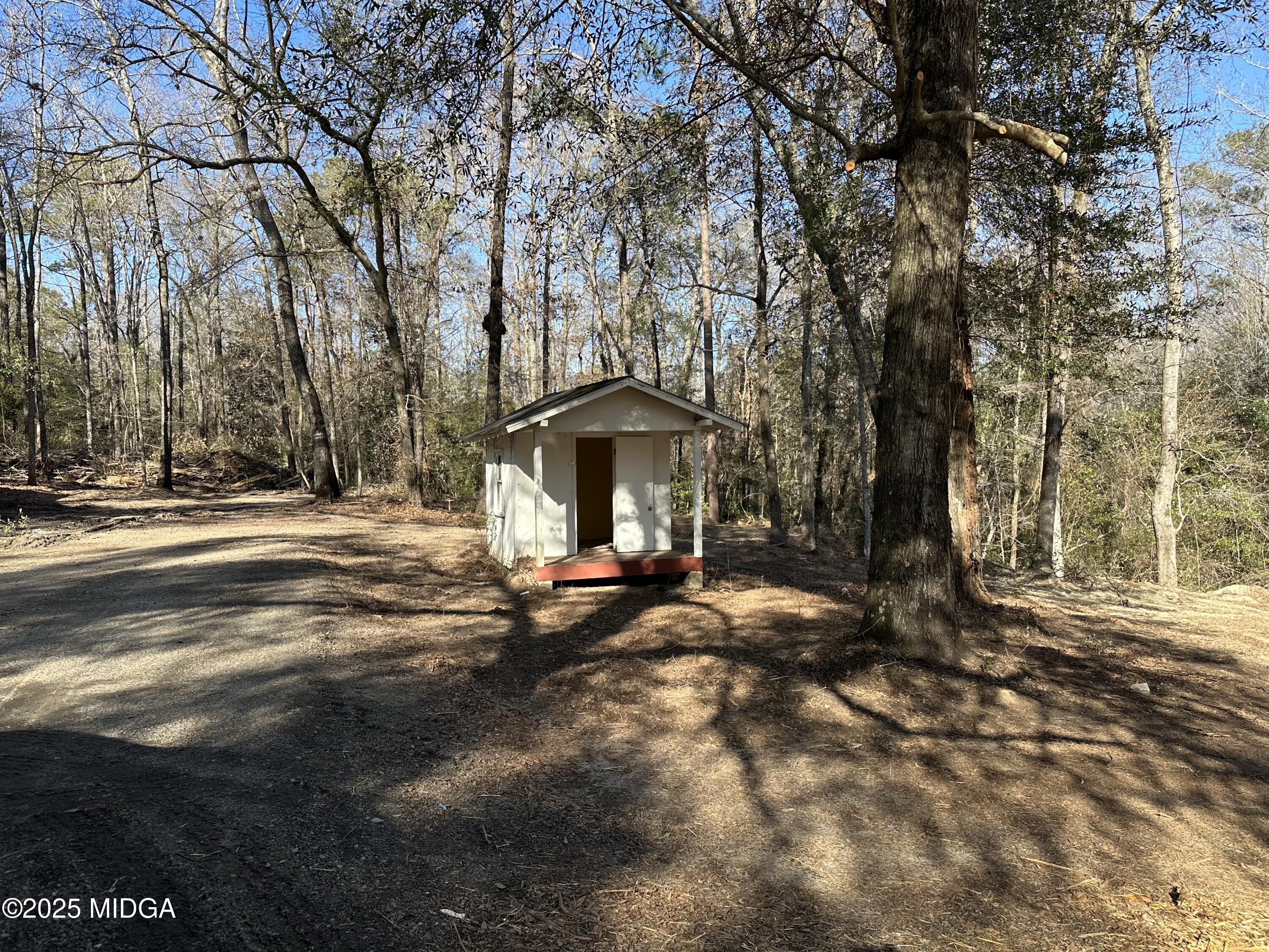 4105 Holley Road Lizella, GA 31052 - Photo 65 of 78 a view of a house with a yard