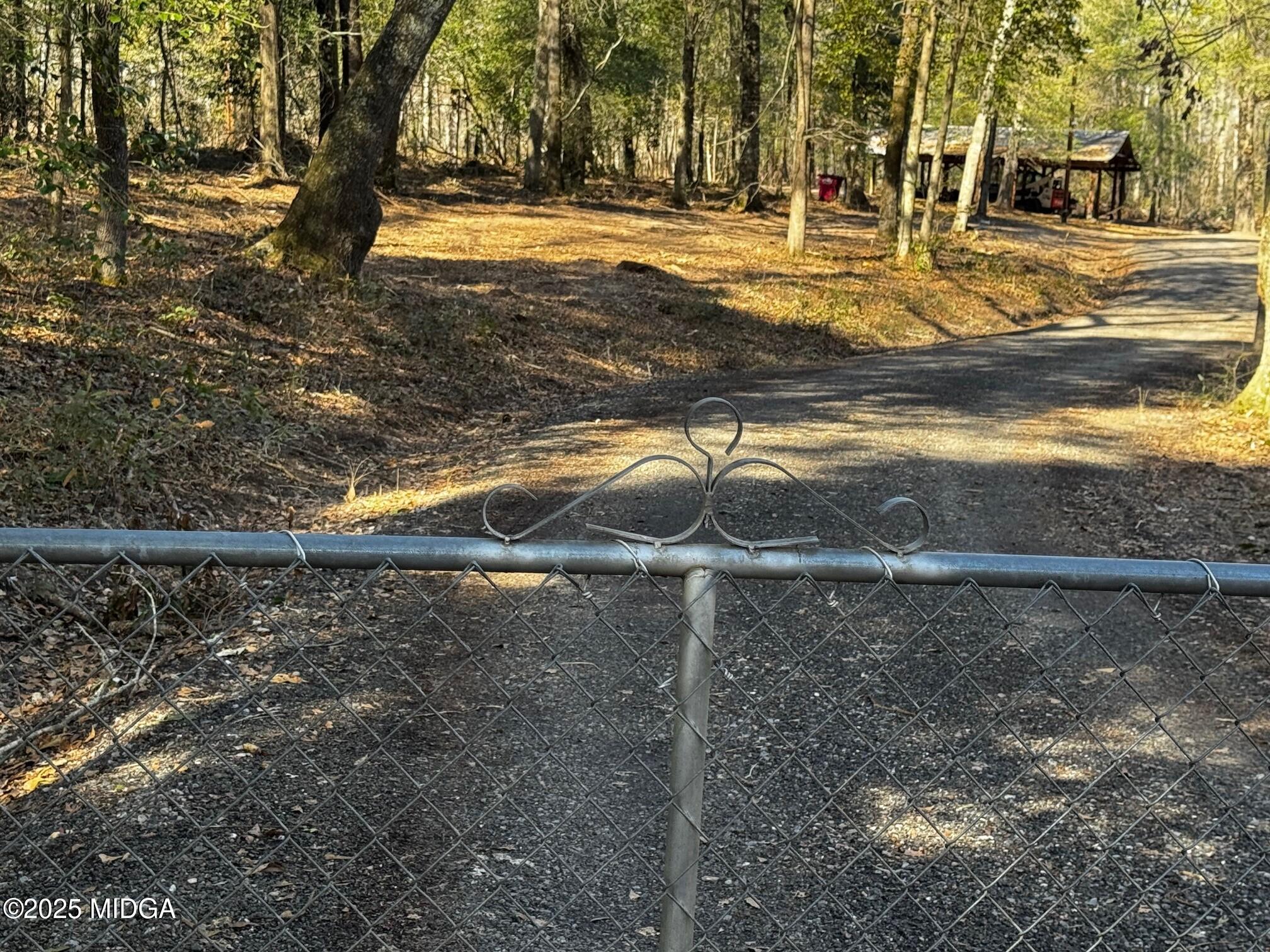4105 Holley Road Lizella, GA 31052 - Photo 71 of 78 a view of a yard with wooden fence