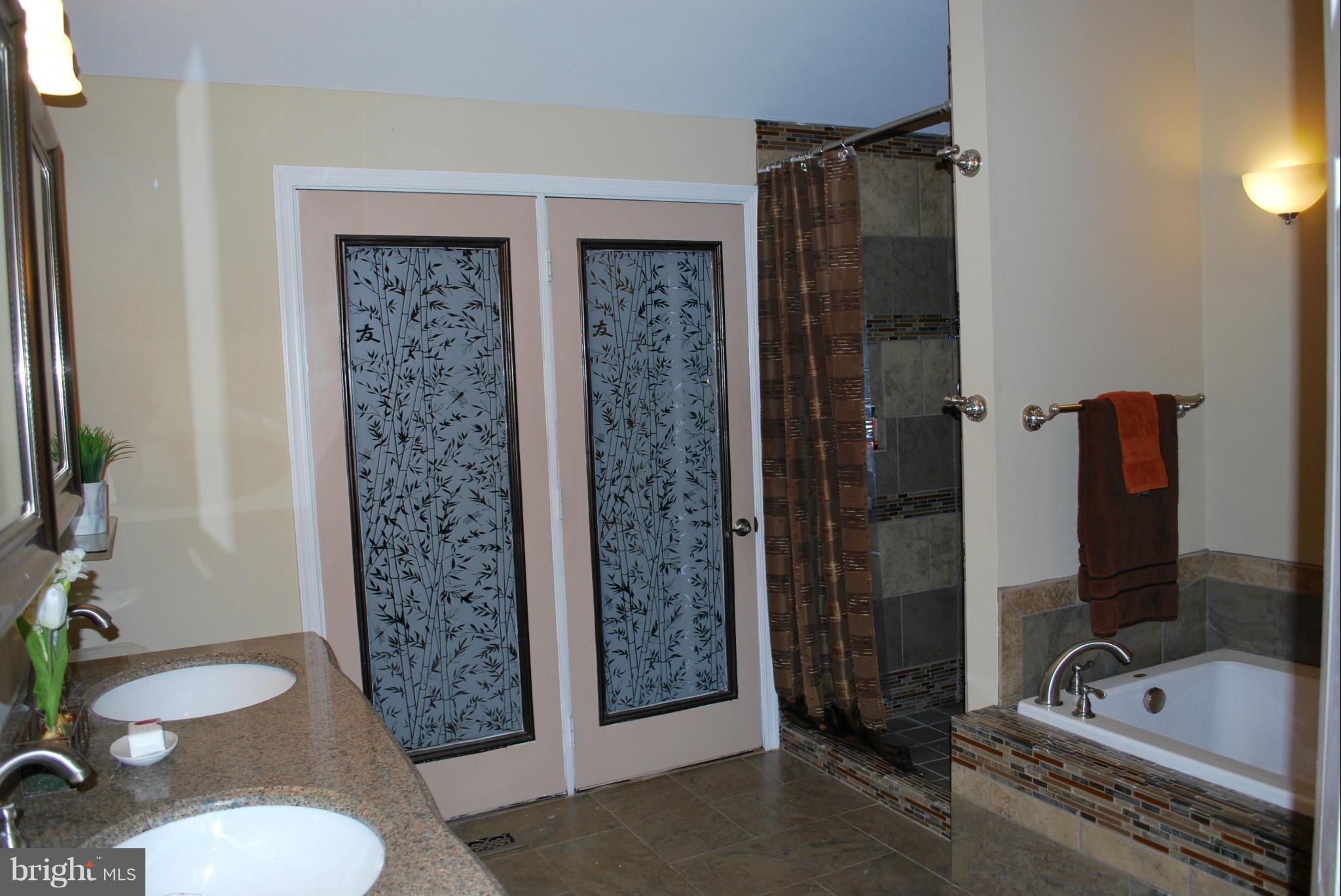 9304 Fort Foote Road Fort Washington, MD 20744 - Photo 22 of 30 Master bath w/french doors to deck