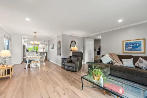 a backyard of a house with yard and outdoor seating