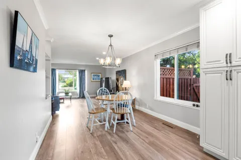 a view of a swimming pool with a yard and plants