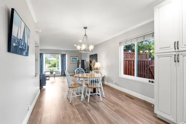 a view of a swimming pool with a yard and plants