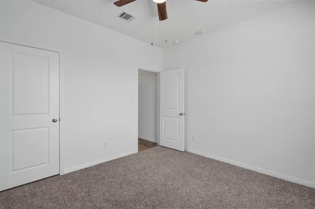 a view of a kitchen with a sink and a stove top oven