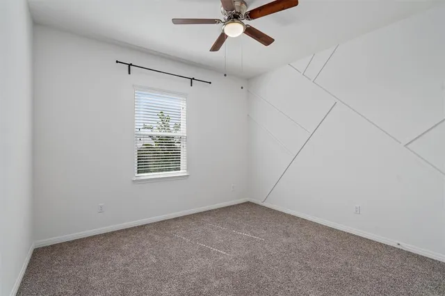 a view of kitchen with sink microwave and cabinets