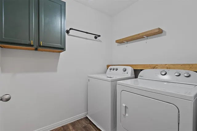 a bathroom with a granite countertop toilet a sink and mirror