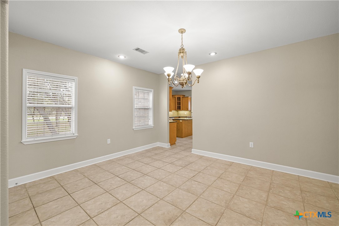 233 Post Oak Bend Inez, TX 77968 - Photo 13 of 45 wooden floor in an empty room with a window