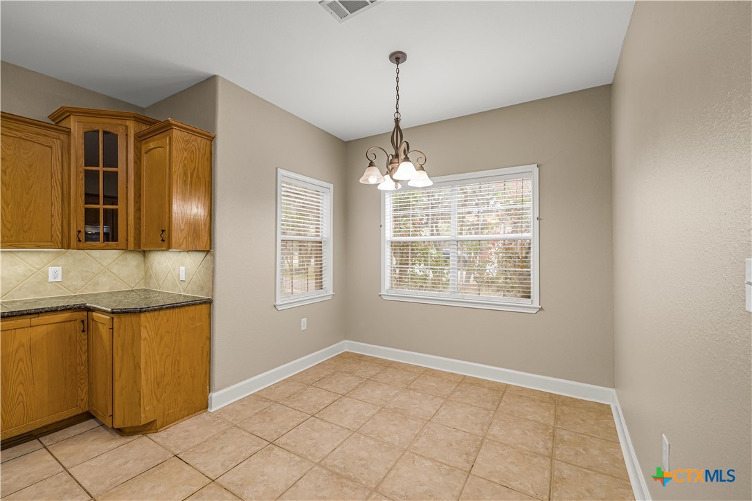 233 Post Oak Bend Inez, TX 77968 - Photo 14 of 45 a view of an empty room with window and chandelier