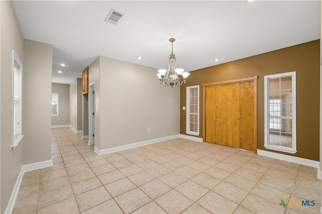 233 Post Oak Bend Inez, TX 77968 - Photo 18 of 45 a view of a room with a chandelier