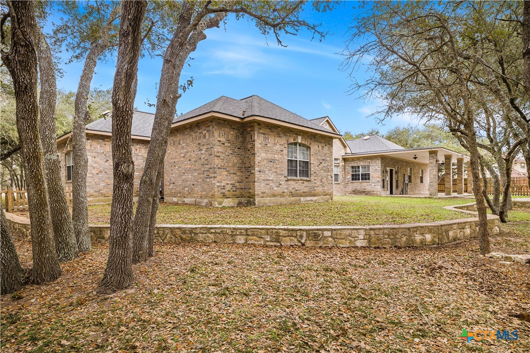 233 Post Oak Bend Inez, TX 77968 - Photo 2 of 45 a front view of a house with a garden